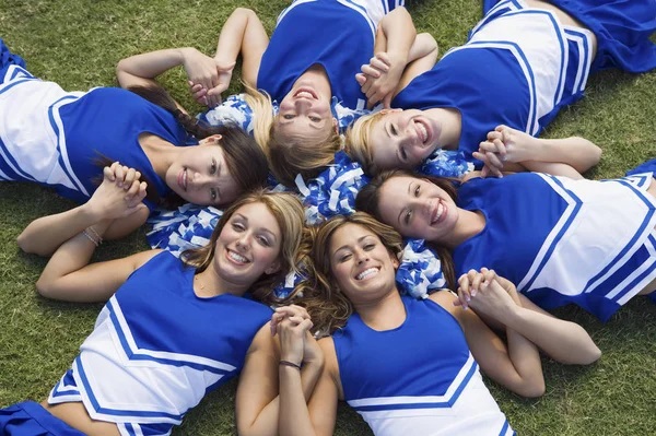 Group of cheerleaders thinking about their successful cheer cookbook fundraiser