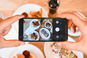 iPhone taking photo of food for fundraising cookbook