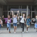 School kids running to get their fundraising cookbooks